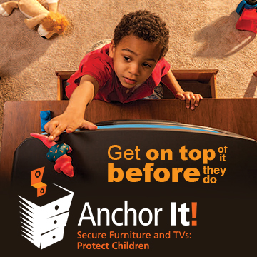 Child climbing furniture reaching for television